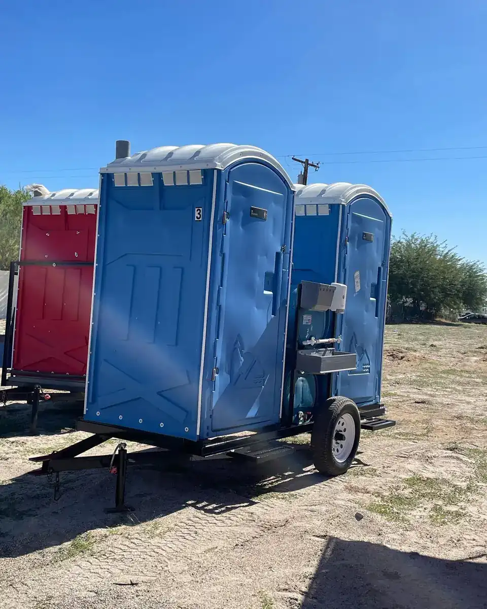 Trailer-mounted portable toilets that can be towed between work zones